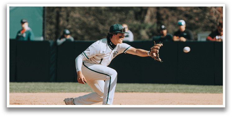 A baseball player sliding into a base. Description generated by AI