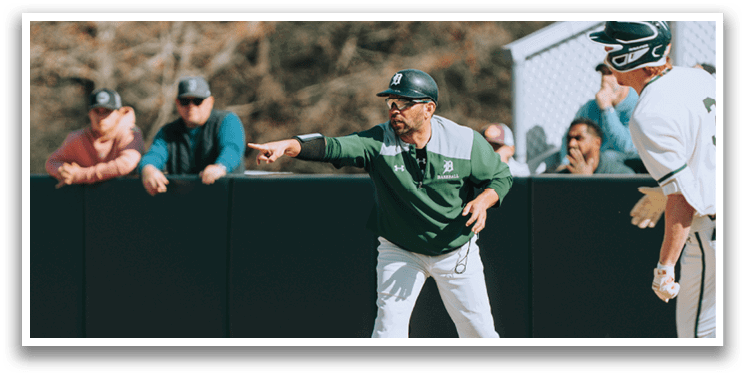 A baseball game is taking place with a man pointing at another man. Description generated by AI