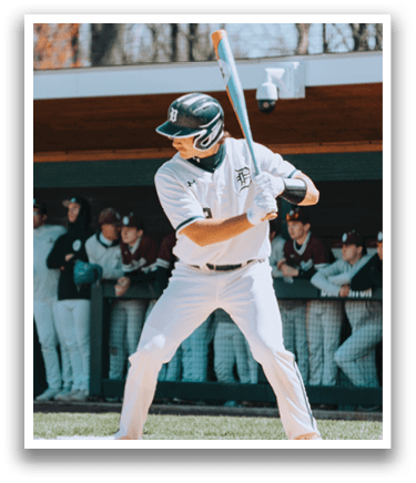 A baseball player is swinging a bat on a field. Description generated by AI