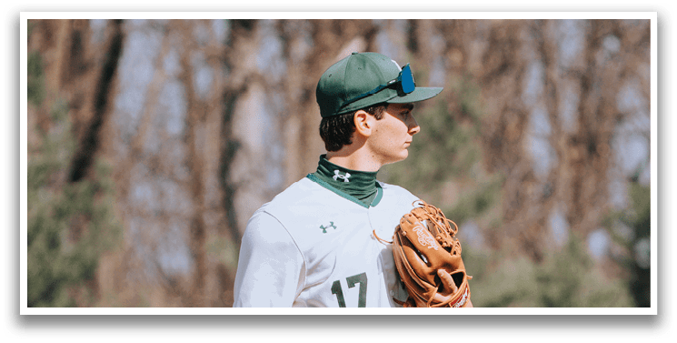 A baseball player wearing a green and white uniform. Description generated by AI