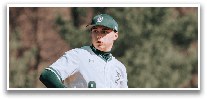 A baseball player wearing a green and white uniform. Description generated by AI