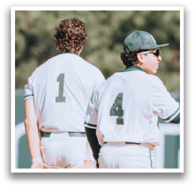 Two baseball players walking on a field. Description generated by AI