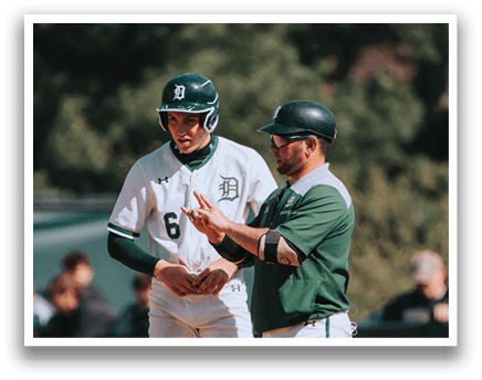 Two baseball players on a field. Description generated by AI