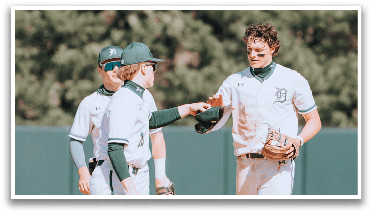 Three baseball players on a field. Description generated by AI