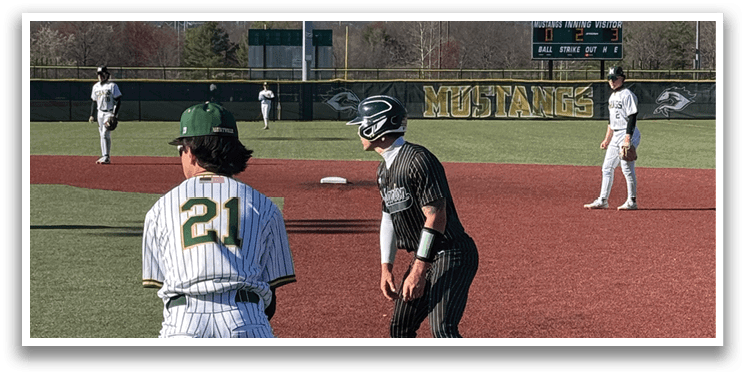 A baseball player is standing on a base. Description generated by AI