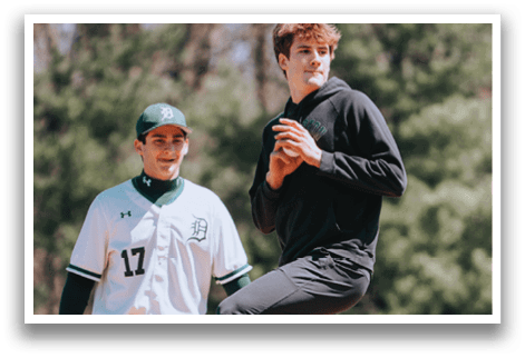 A man wearing a black shirt and black pants is jumping in the air. Description generated by AI