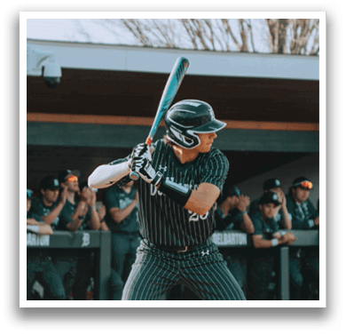 A baseball player is swinging a bat at a ball. Description generated by AI