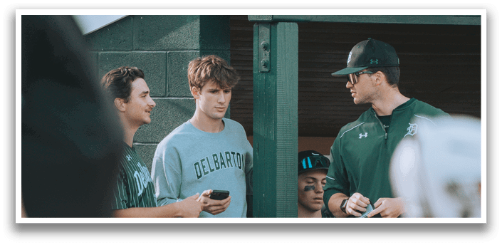 A group of people standing outside. Description generated by AI