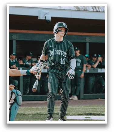 A baseball player wearing a green and white uniform. Description generated by AI