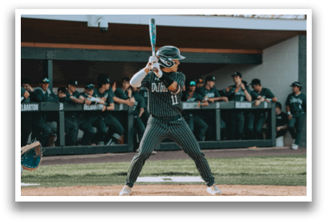 A baseball player swinging a bat. Description generated by AI