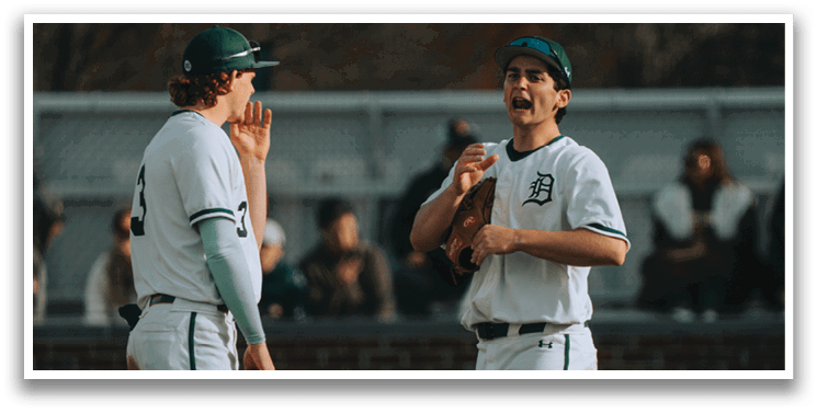 Two baseball players talking on the field. Description generated by AI