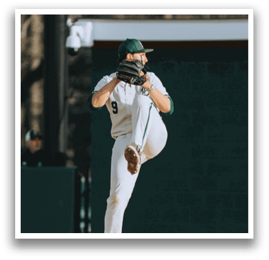 A baseball player in a white uniform is pitching a ball. Description generated by AI