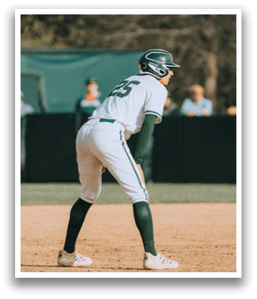 A baseball player wearing a green and white uniform. Description generated by AI