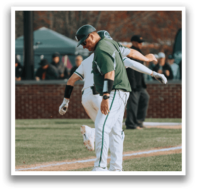 A baseball player is sliding into home plate. Description generated by AI