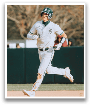 A baseball player running on the field. Description generated by AI