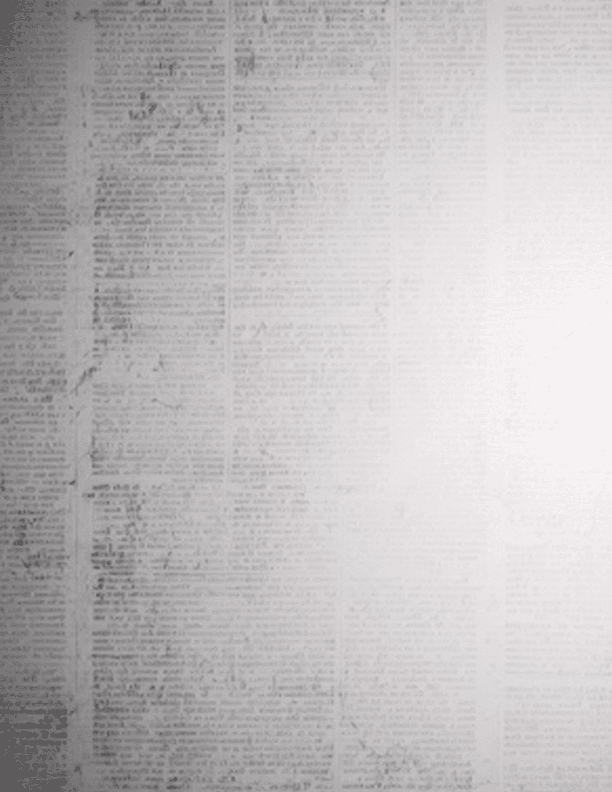 A white wall with a newspaper print. Description generated by AI