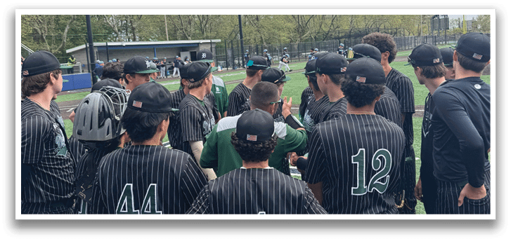 A group of baseball players wearing black and green uniforms. Description generated by AI