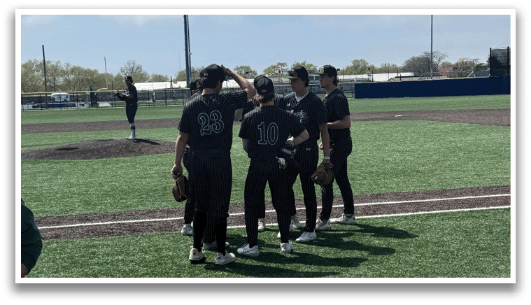 A group of baseball players standing on a field. Description generated by AI