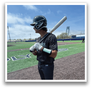 A baseball player wearing a black and white striped uniform. Description generated by AI