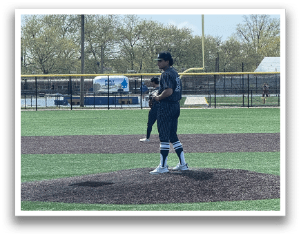 A baseball pitcher on the mound. Description generated by AI