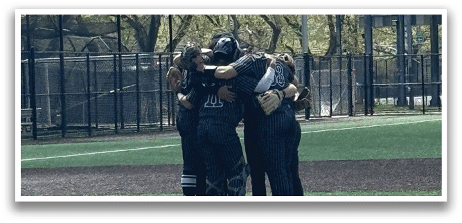 A group of people hugging on a baseball field. Description generated by AI