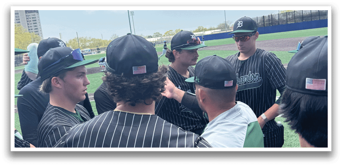 A group of baseball players wearing black and white uniforms. Description generated by AI