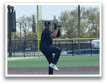 A baseball player is pitching a ball on a field. Description generated by AI