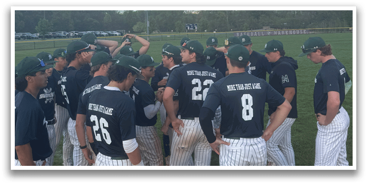 A group of baseball players wearing black and white uniforms. Description generated by AI