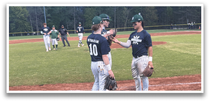 A group of baseball players on a field. Description generated by AI