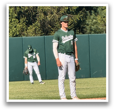 A baseball player is standing on the field. Description generated by AI