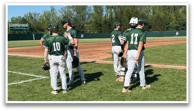 Baseball players on a field. Description generated by AI