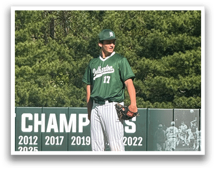 A baseball player standing on a mound. Description generated by AI