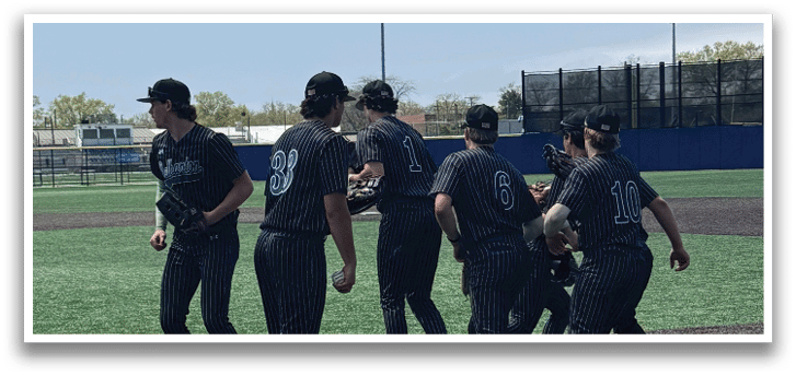 A group of girls playing softball on a field. Description generated by AI