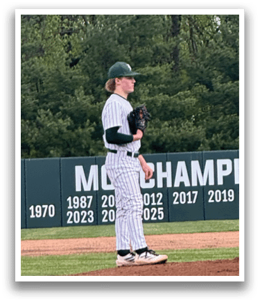 A baseball player is standing on the pitcher's mound. Description generated by AI