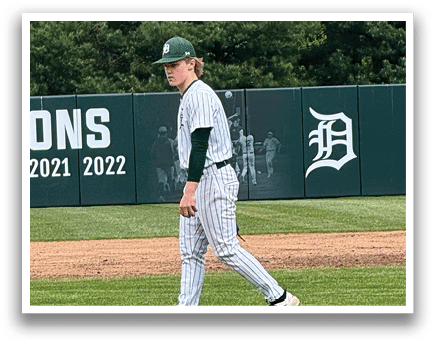 A baseball player is walking on the field. Description generated by AI