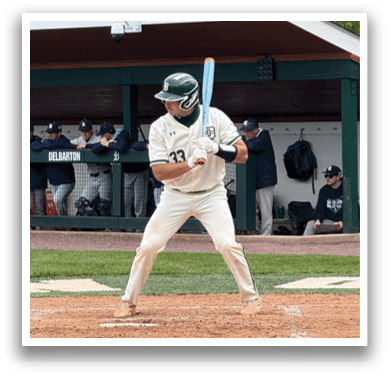 Baseball player holding a bat. Description generated by AI