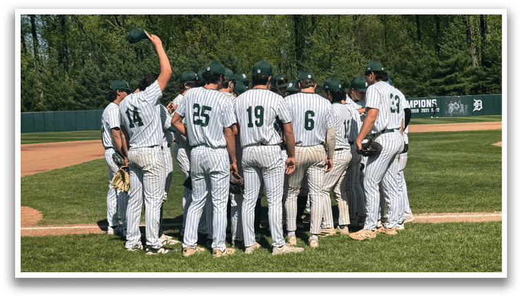 A group of baseball players on a field. Description generated by AI