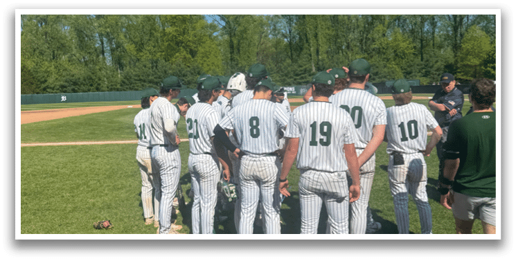 Baseball players standing on the field. Description generated by AI