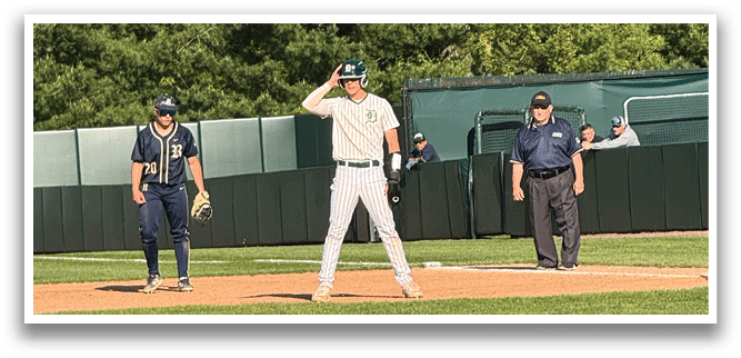 A baseball player is standing on the field with his arm raised. Description generated by AI