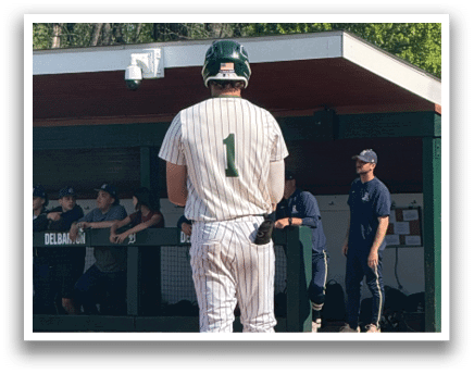 A baseball player is standing on the field. Description generated by AI