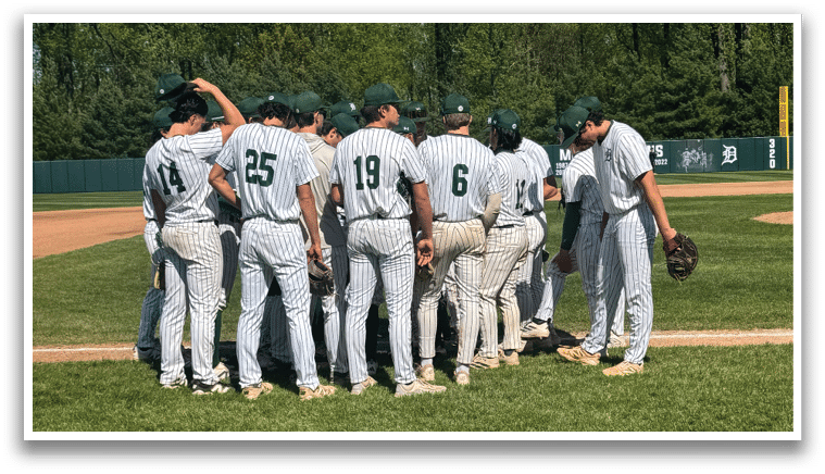A group of baseball players standing on a field. Description generated by AI