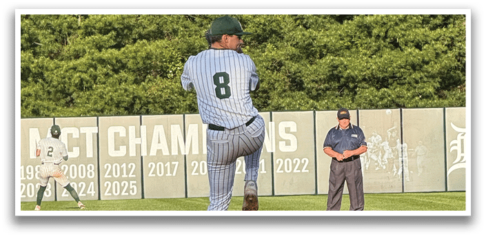 A baseball player in a green cap and white uniform is throwing a pitch. Description generated by AI