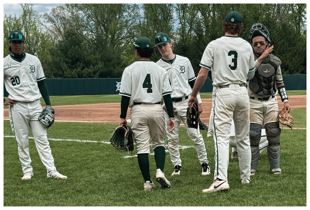 A group of baseball players on the field. Description generated by AI