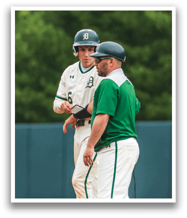 Two baseball players on a field. Description generated by AI