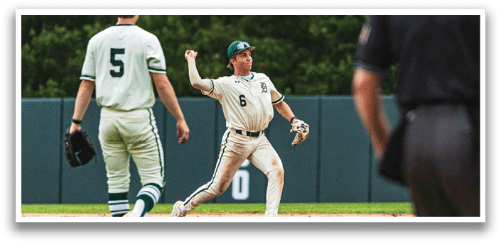 A baseball player wearing a white uniform and a blue hat. Description generated by AI