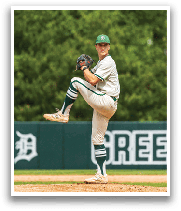 A baseball player in a white uniform is pitching a ball. Description generated by AI