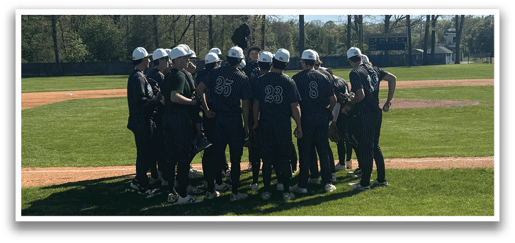 A group of baseball players on a field. Description generated by AI