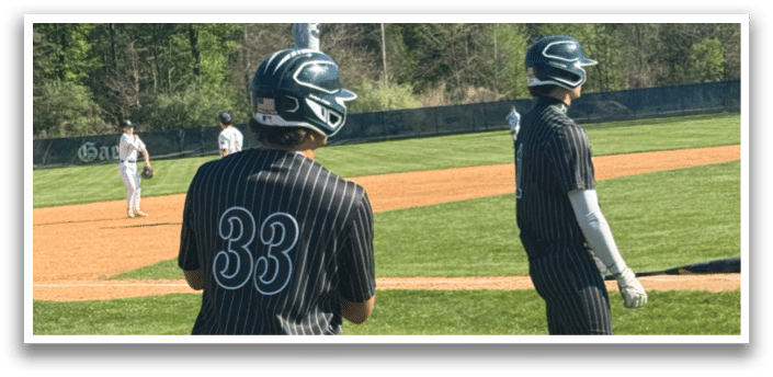A baseball player wearing a number 33 jersey. Description generated by AI