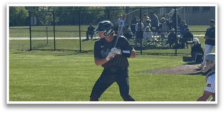 A baseball player is swinging a bat at a ball. Description generated by AI