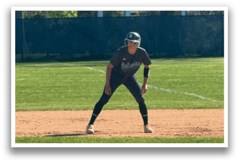 A baseball player is standing on the field. Description generated by AI